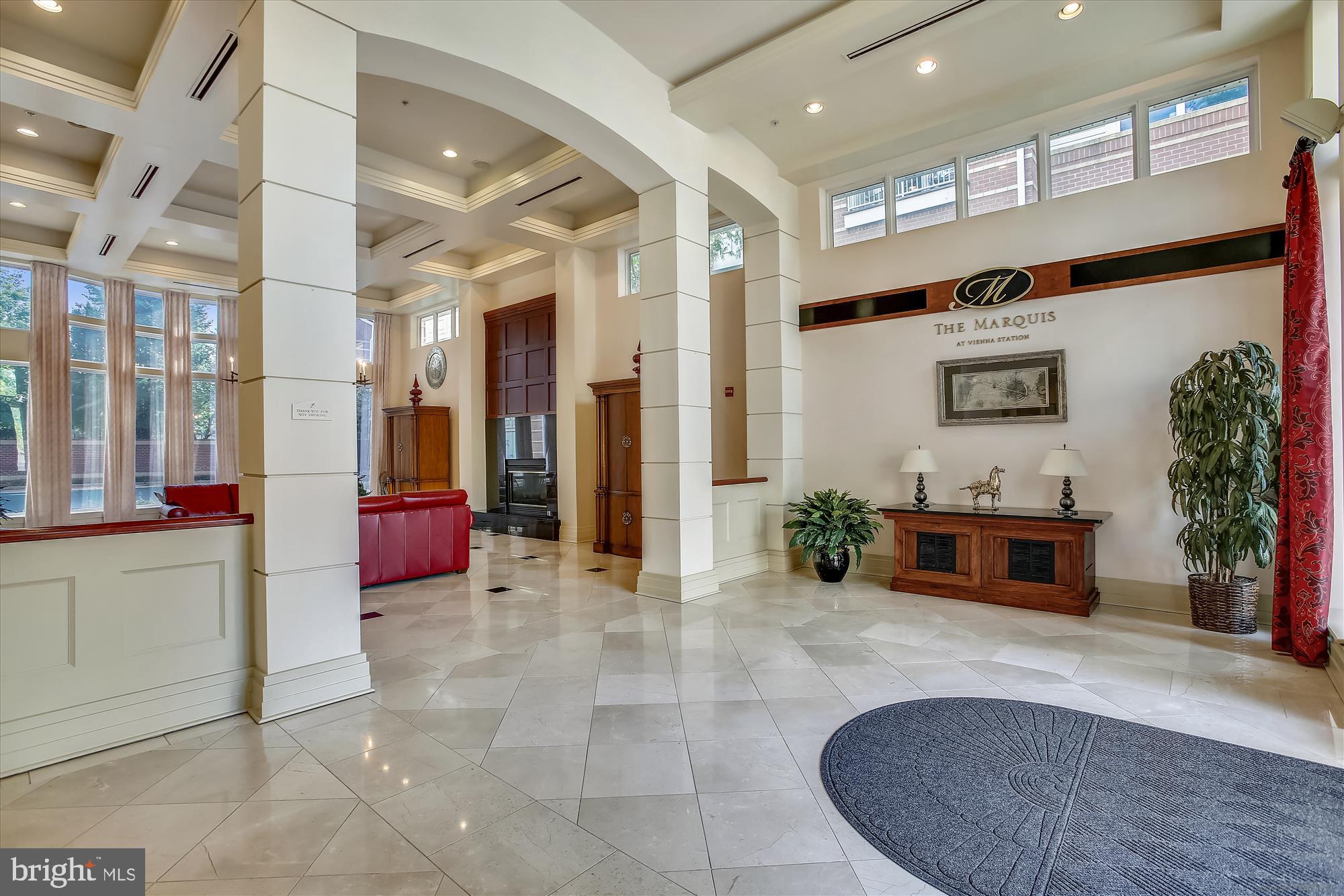 9490 Virginia Center Boulevard, Unit 130 Vienna, VA 22181 - Photo 37 of 57 a lobby with furniture and a fireplace