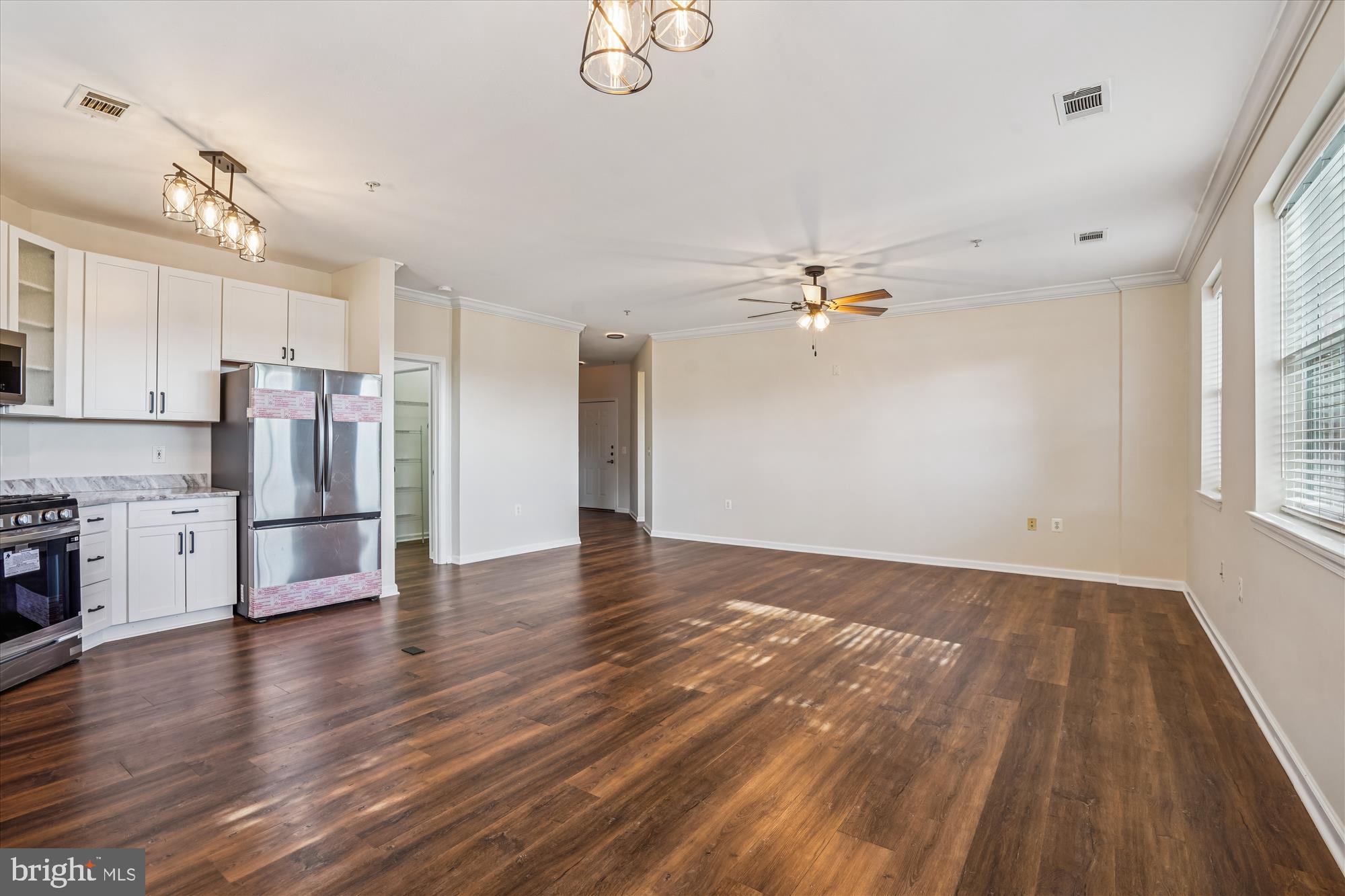 9490 Virginia Center Boulevard, Unit 130 Vienna, VA 22181 - Photo 8 of 57 a view of a kitchen with a sink a refrigerator and window