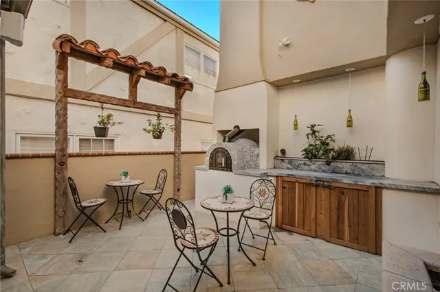 a view of a patio with table and chairs