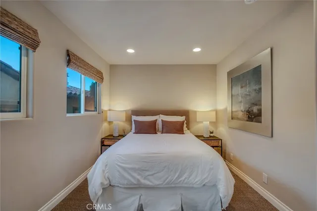 a bathroom with a granite countertop sink toilet mirror and shower
