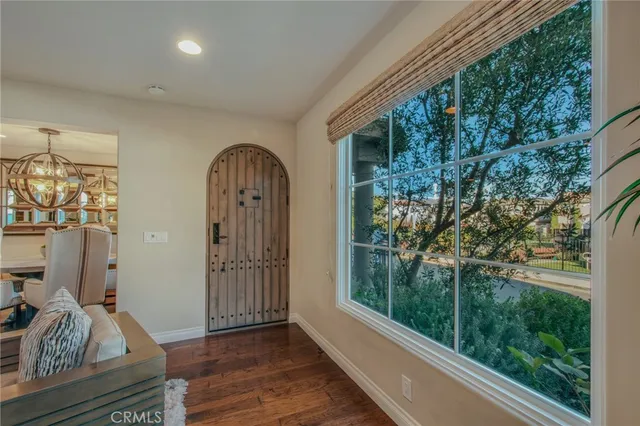 a view of front door with wooden floor