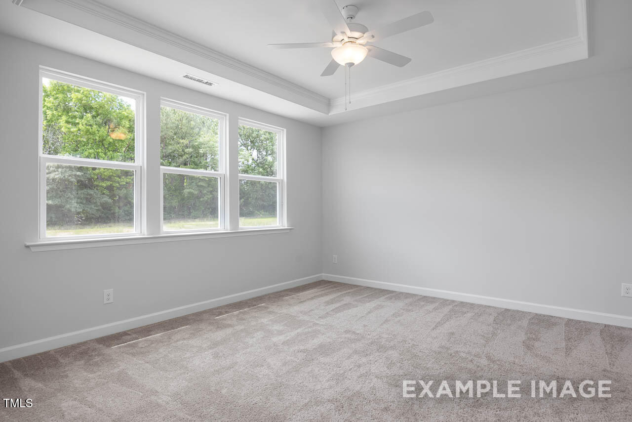 271 Crop Road Angier, NC 27501 - Photo 16 of 28 an empty room with a window