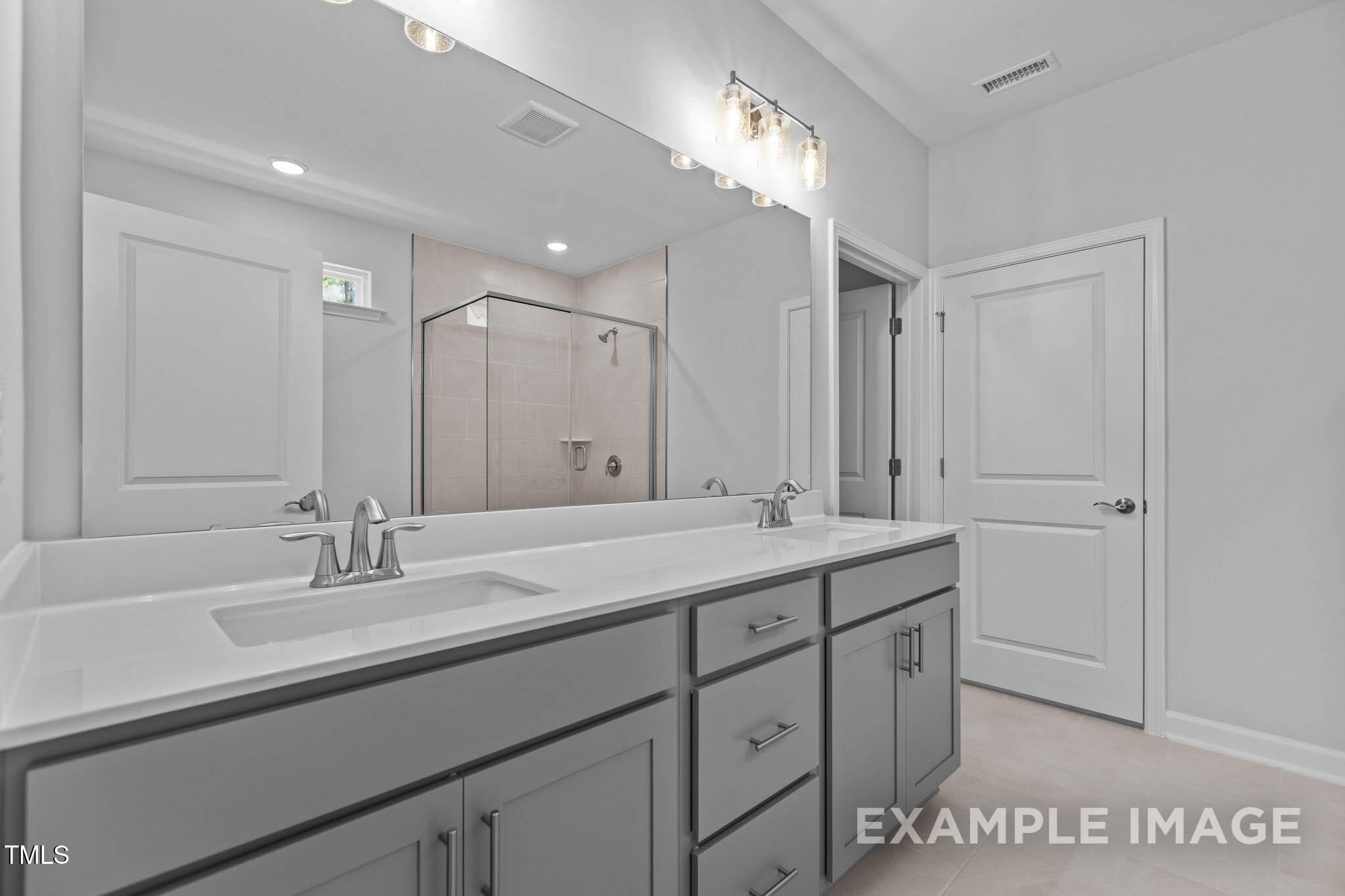 271 Crop Road Angier, NC 27501 - Photo 17 of 28 a bathroom with a sink double vanity and a mirror