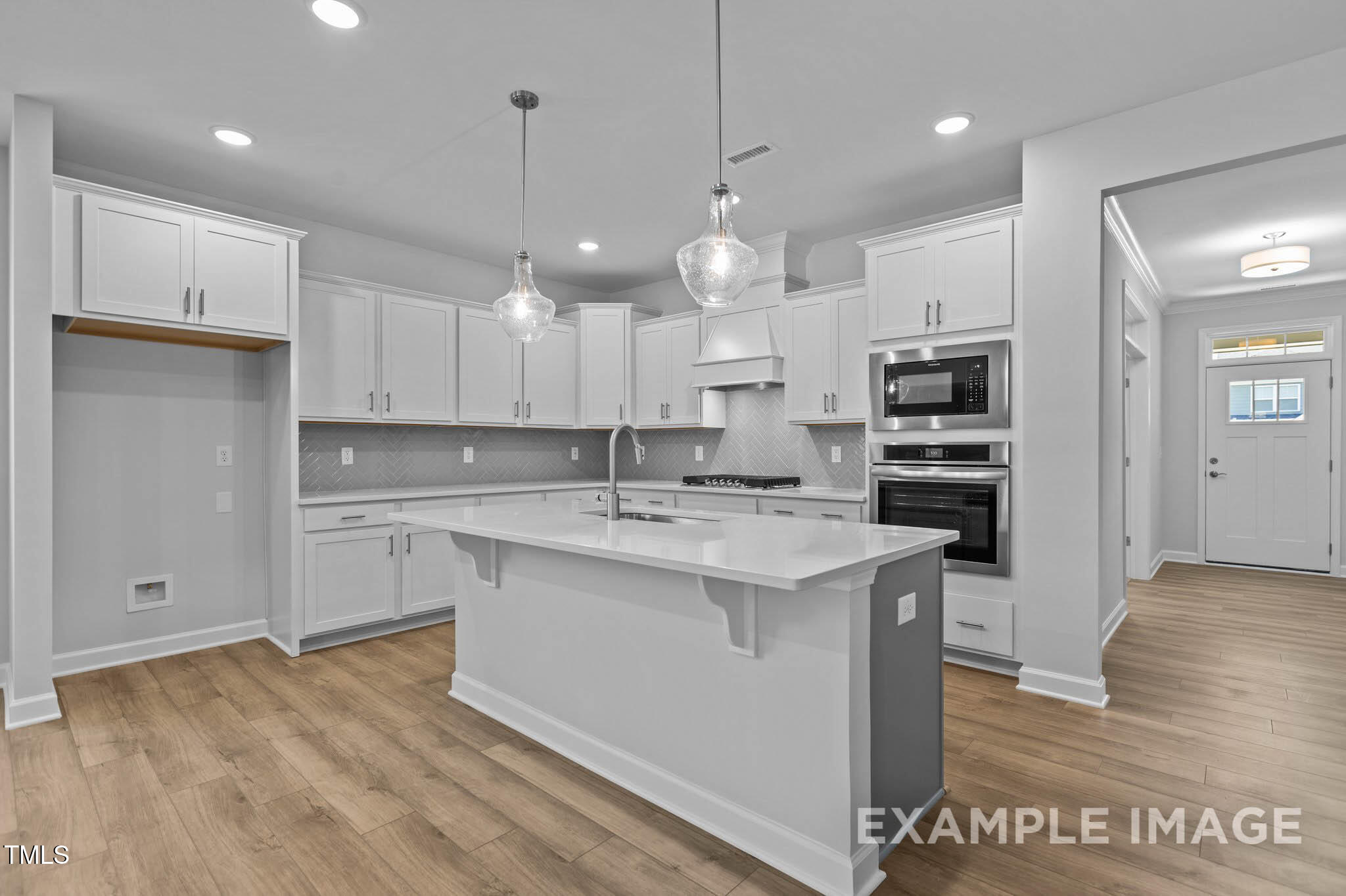 271 Crop Road Angier, NC 27501 - Photo 2 of 28 a kitchen with kitchen island a sink stainless steel appliances and cabinets