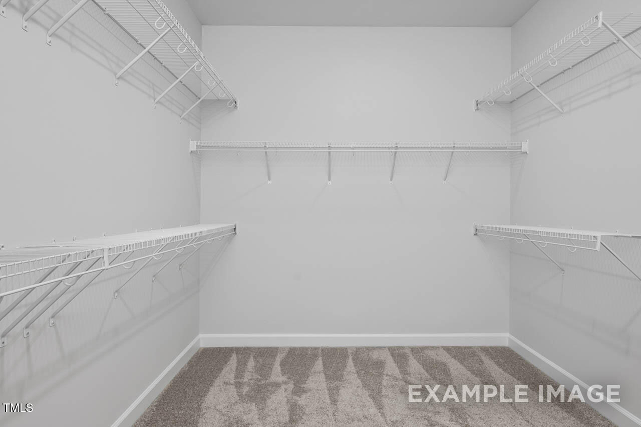 271 Crop Road Angier, NC 27501 - Photo 22 of 28 a view of a room with racks on the wall
