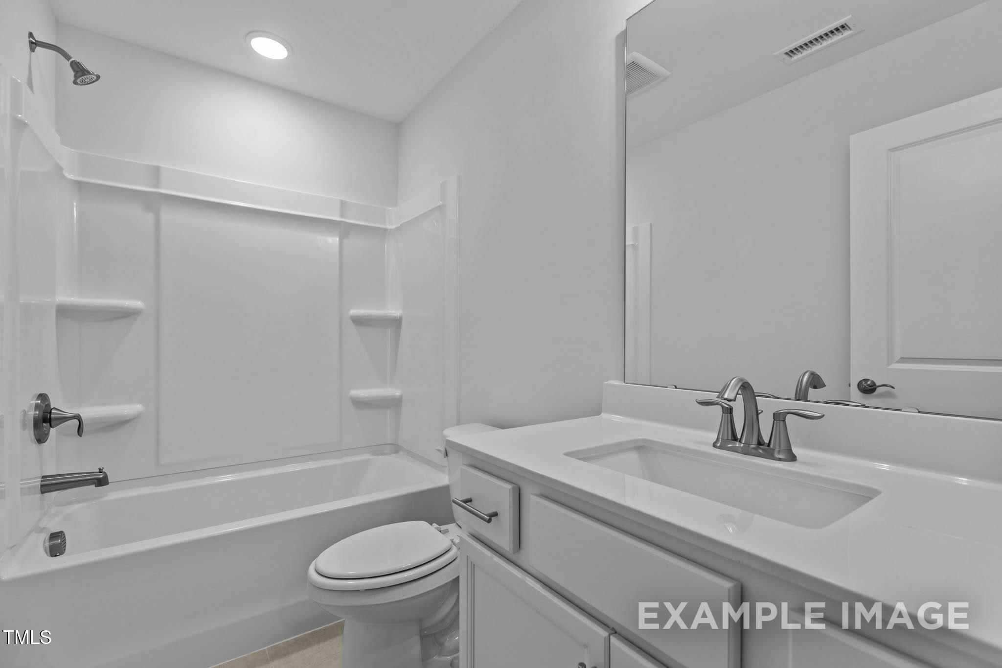 271 Crop Road Angier, NC 27501 - Photo 23 of 28 a bathroom with a granite countertop sink a toilet and shower