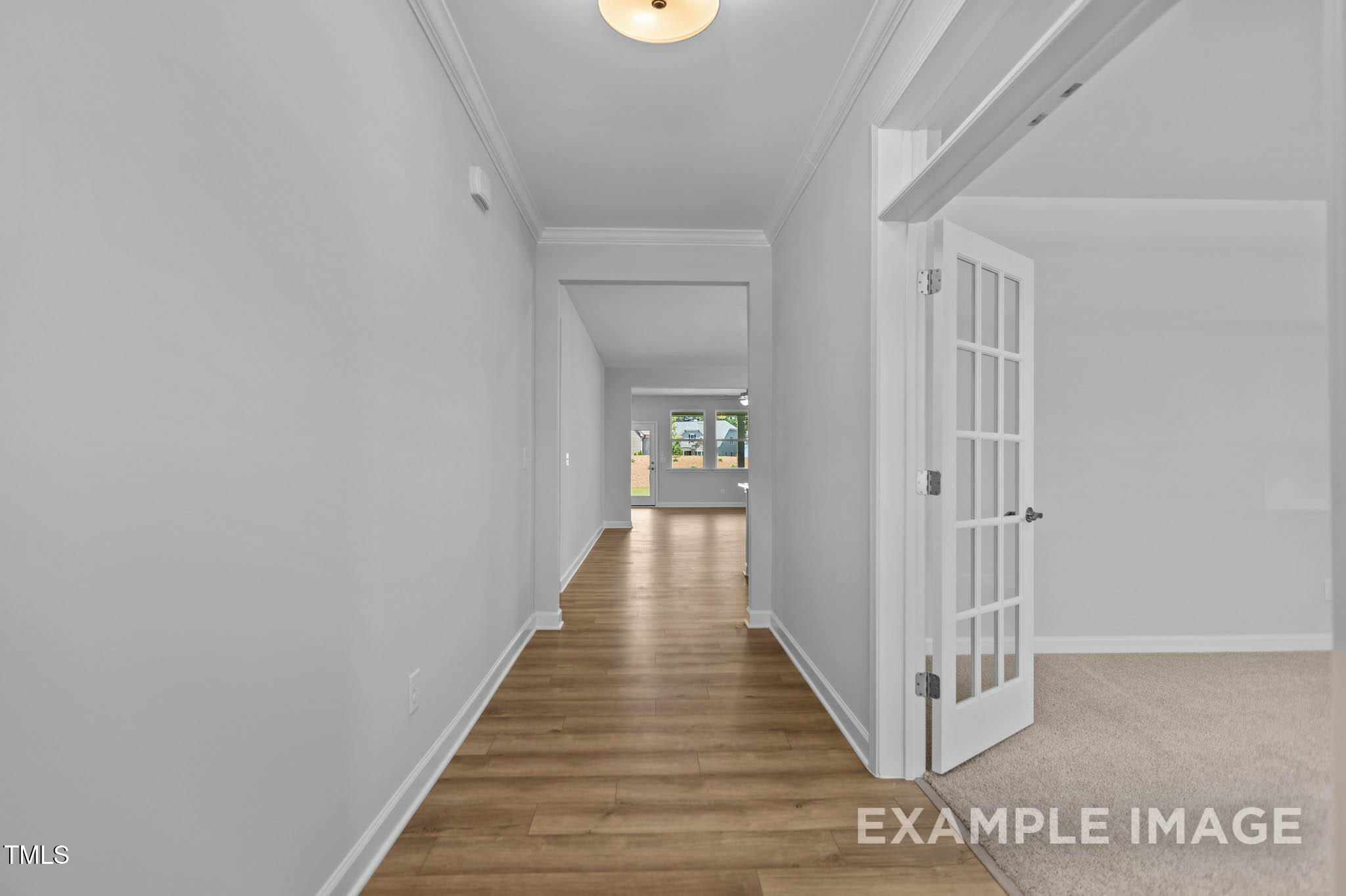 271 Crop Road Angier, NC 27501 - Photo 3 of 28 a view of a hallway with wooden floor