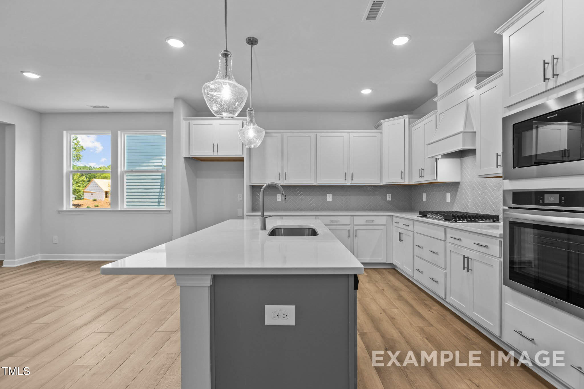 271 Crop Road Angier, NC 27501 - Photo 7 of 28 a kitchen with stainless steel appliances granite countertop a sink dishwasher a stove and a refrigerator with wooden floor