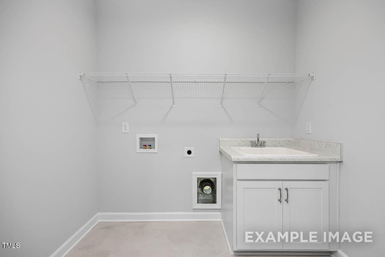 271 Crop Road Angier, NC 27501 - Photo 9 of 28 a bathroom with a sink and vanity