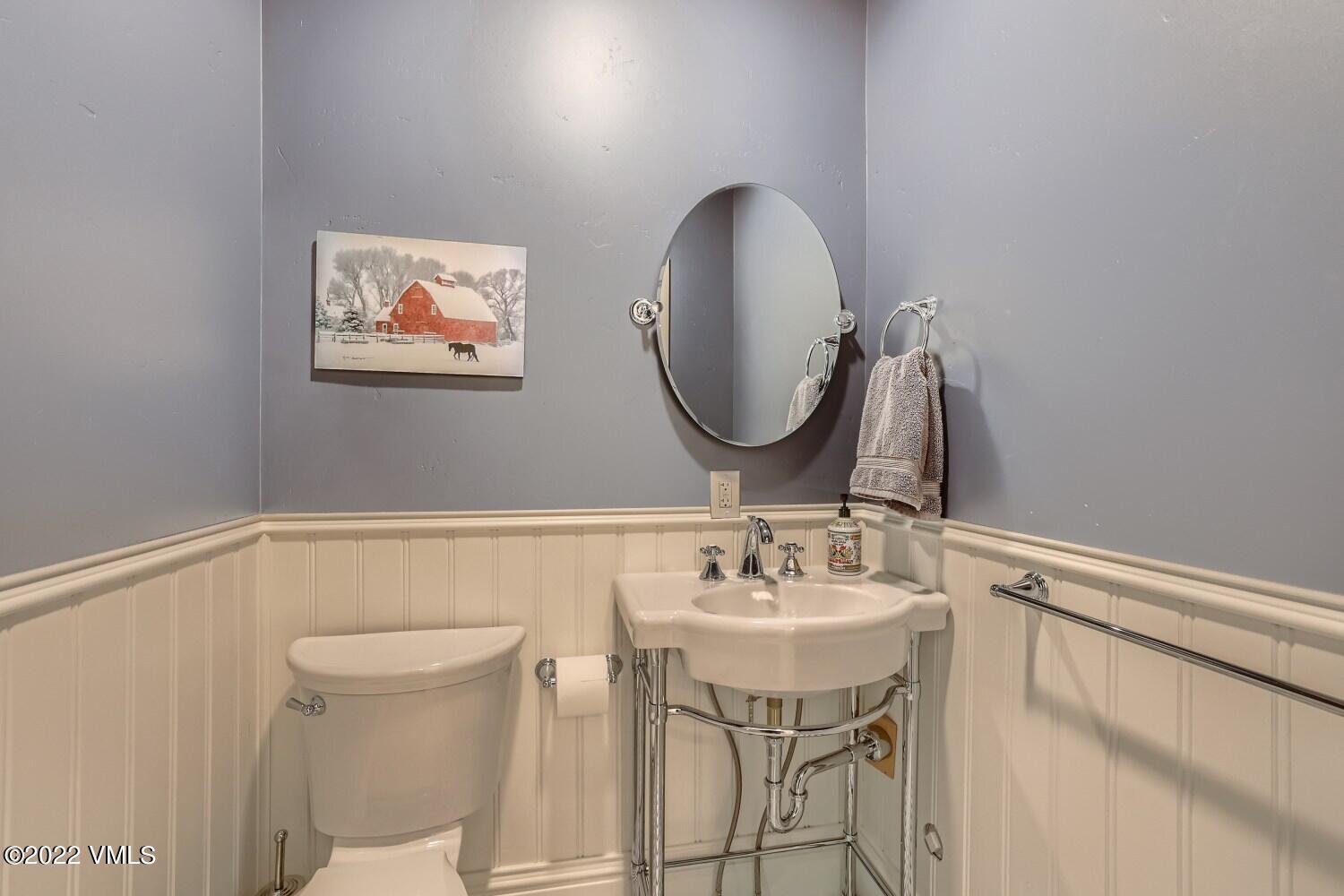 306 Howard Street Eagle, CO 81631 - Photo 12 of 30 a bathroom with a sink mirror and toilet