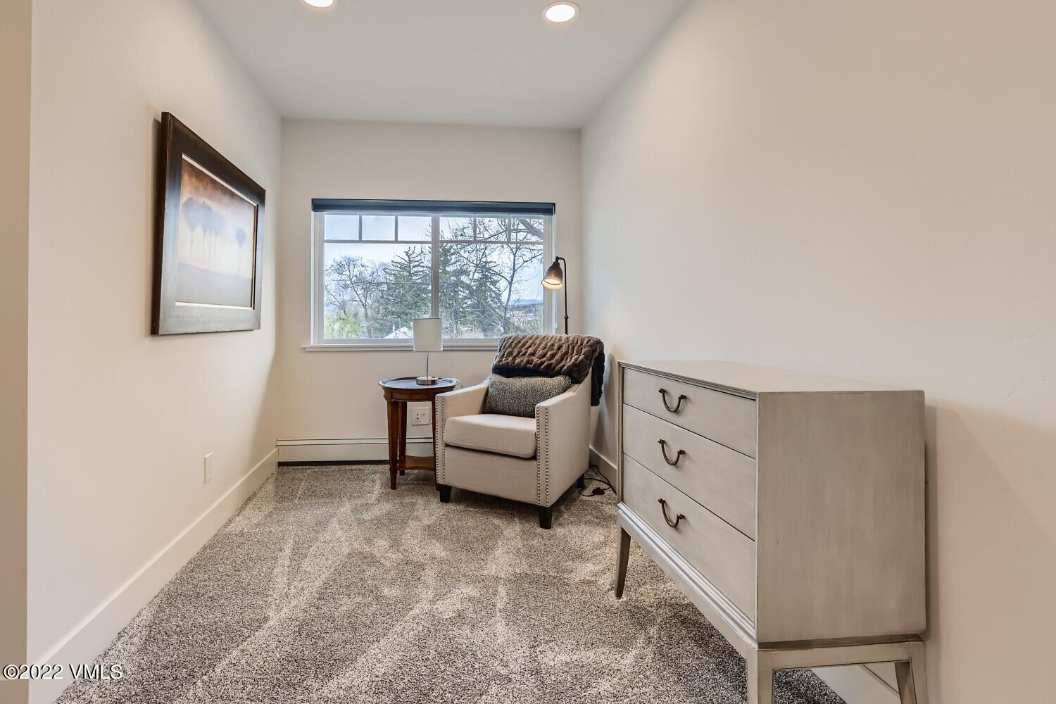 306 Howard Street Eagle, CO 81631 - Photo 18 of 30 a living room with furniture and a large window