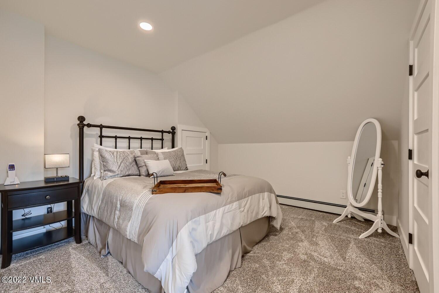 306 Howard Street Eagle, CO 81631 - Photo 19 of 30 a bedroom with a bed and a window