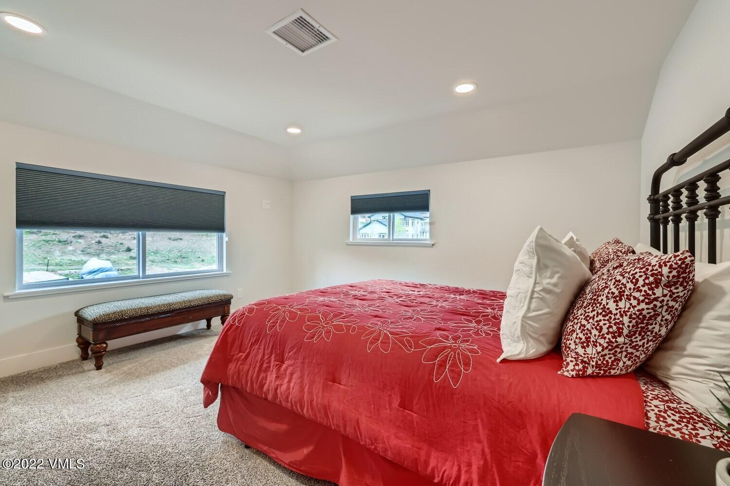 306 Howard Street Eagle, CO 81631 - Photo 22 of 30 a bedroom with a bed and a large window
