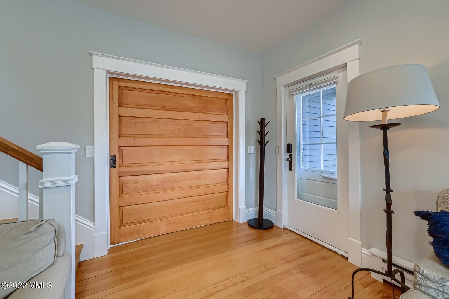 306 Howard Street Eagle, CO 81631 - Photo 5 of 30 a view of room with hardwood floor and cabinet