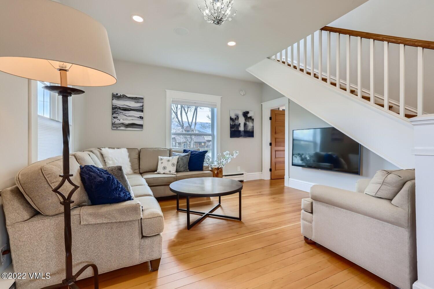 306 Howard Street Eagle, CO 81631 - Photo 7 of 30 a living room with furniture and a flat screen tv