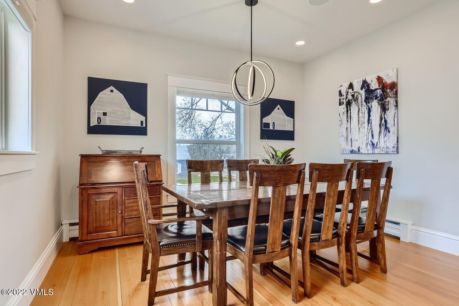 306 Howard Street Eagle, CO 81631 - Photo 8 of 30 a view of a dining room with furniture wooden floor and chandelier