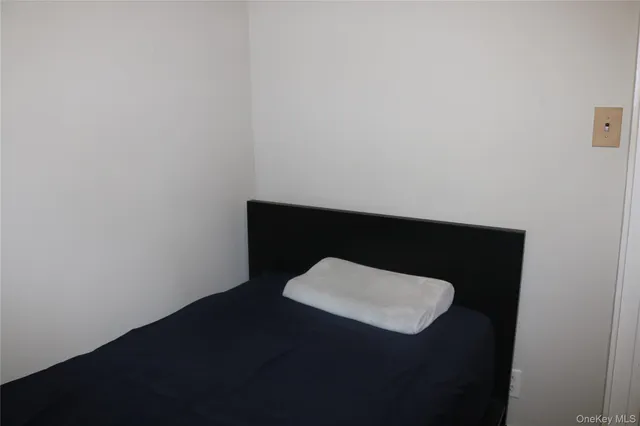 a wooden bench sitting in a bathroom