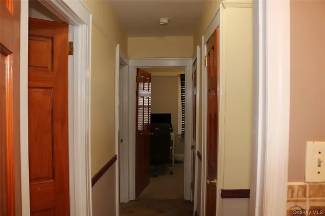 a view of a bathroom from a hallway