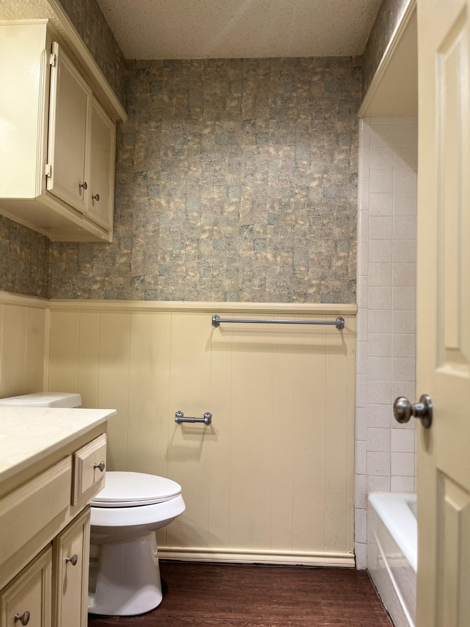 2308 74th Street, Unit A2 Lubbock, TX 79423 - Photo 11 of 16 a bathroom with a toilet a sink and bathtub