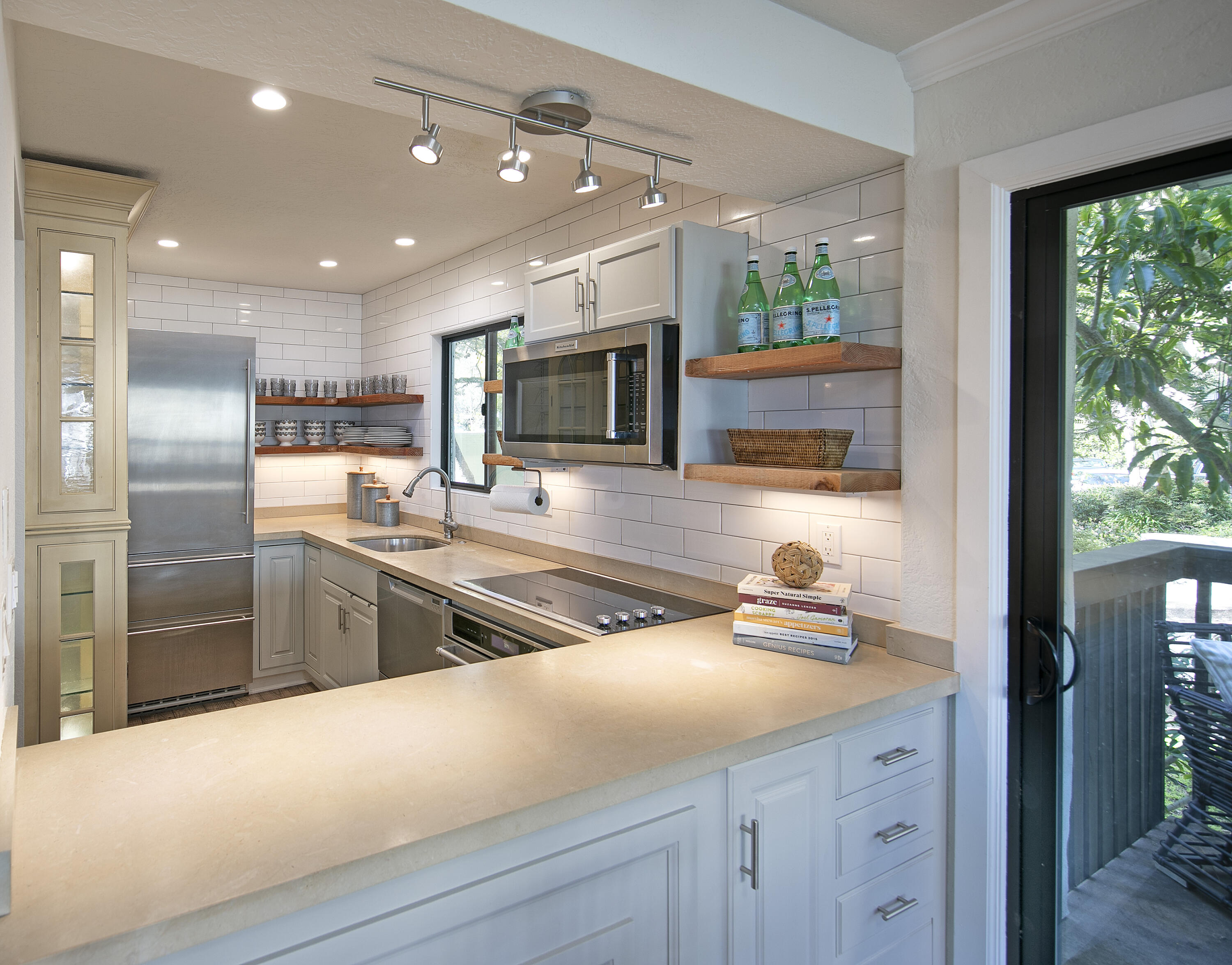 3375 Foothill Road, Unit 821 Carpinteria, CA 93013 - Photo 1 of 12 a kitchen with counter top space cabinets and stainless steel appliances