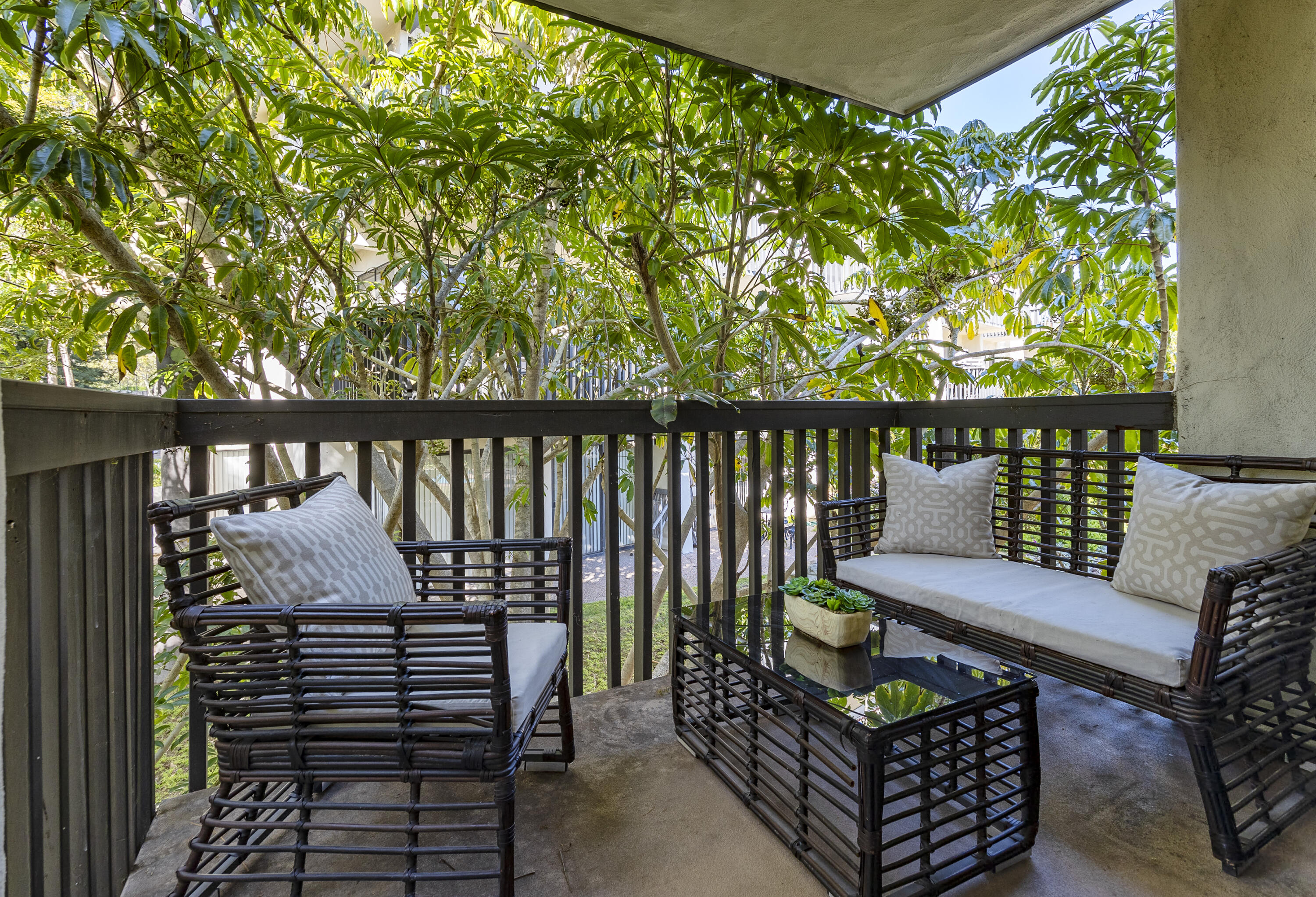 3375 Foothill Road, Unit 821 Carpinteria, CA 93013 - Photo 12 of 12 a balcony with chairs and wooden fence