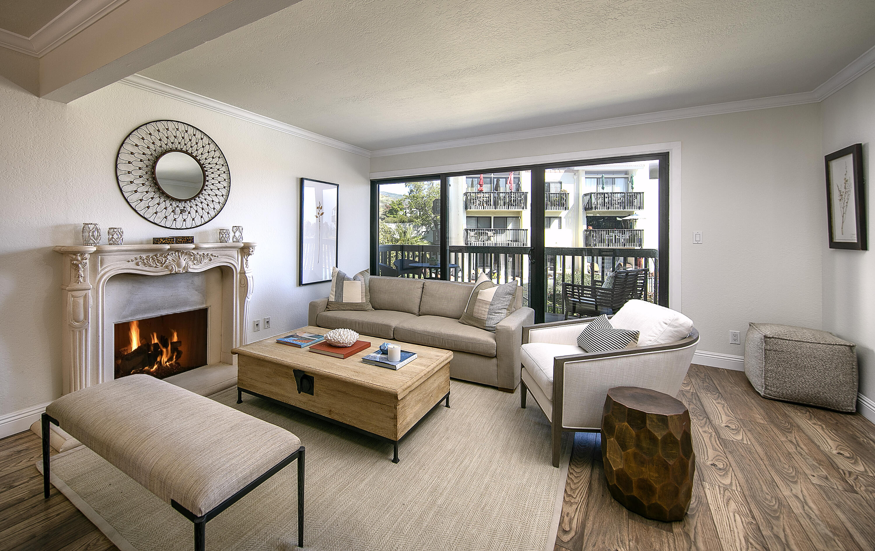 3375 Foothill Road, Unit 821 Carpinteria, CA 93013 - Photo 2 of 12 a living room with furniture and a fireplace