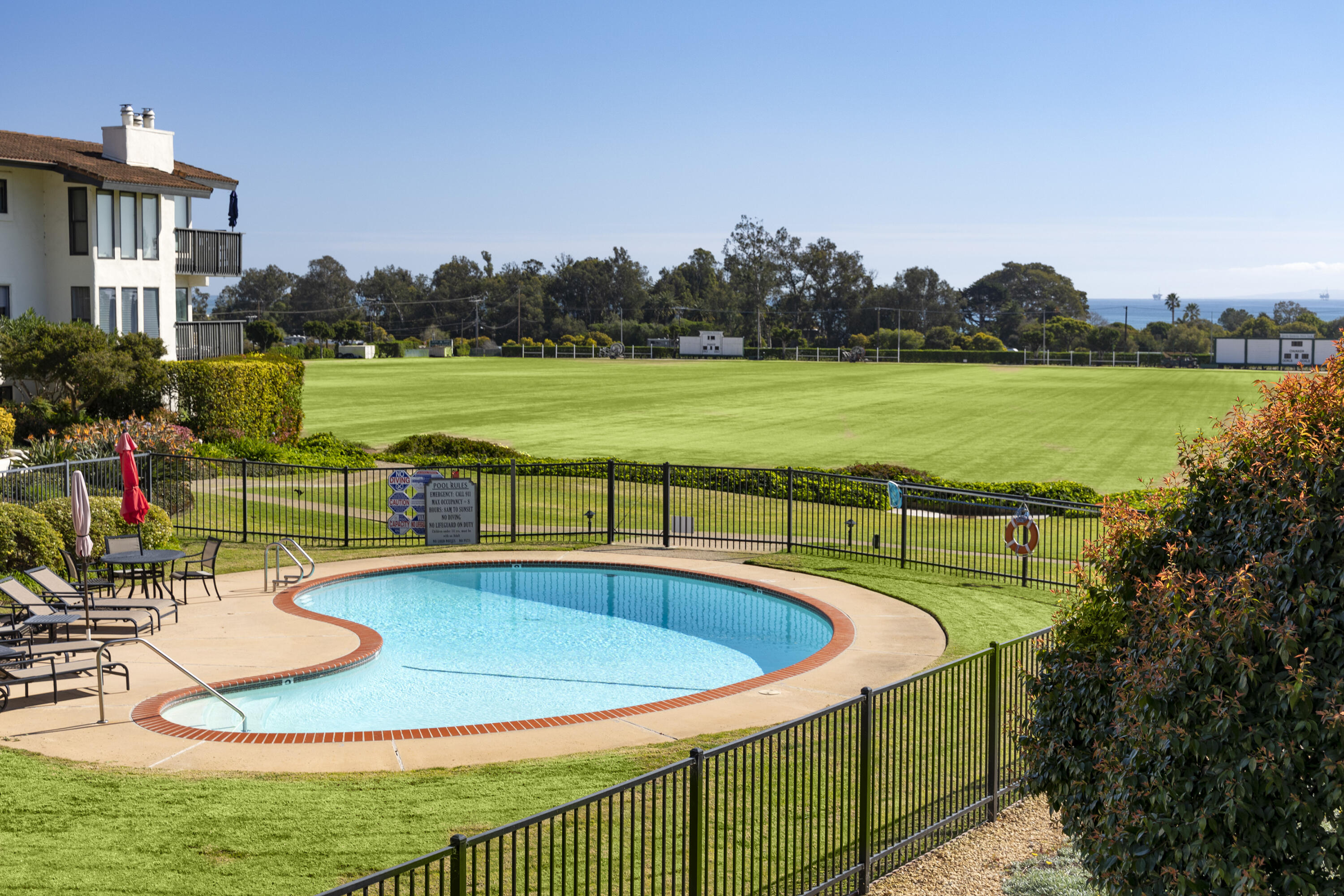 3375 Foothill Road, Unit 821 Carpinteria, CA 93013 - Photo 6 of 12 a view of a swimming pool with a patio