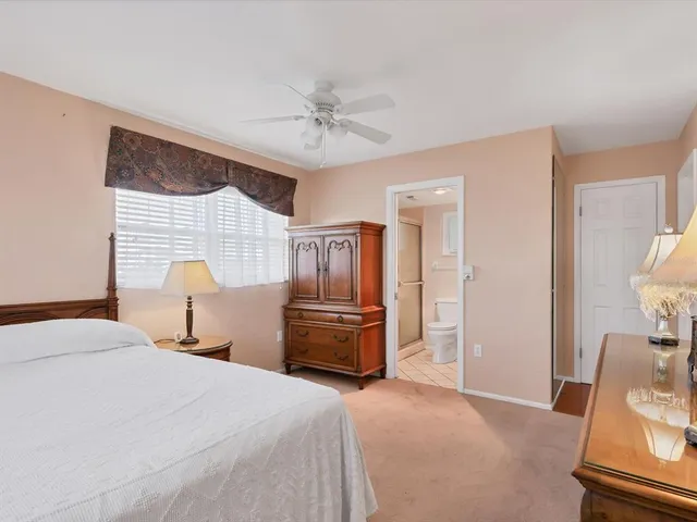 a bedroom with a bed and furniture