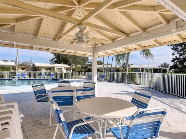a view of outdoor space with swimming pool and seating