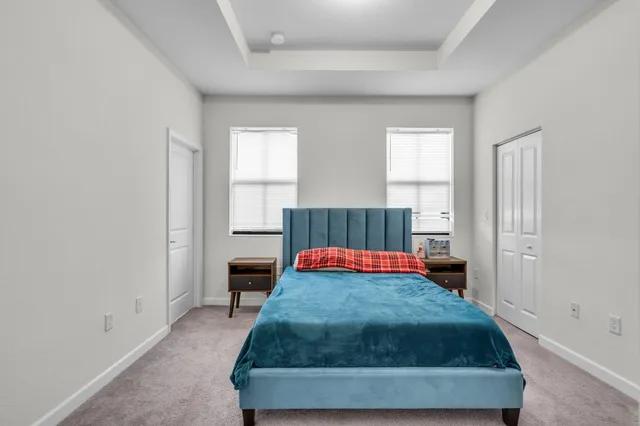 a bedroom with a bed and window