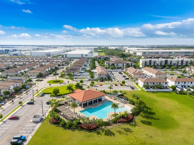 an aerial view of residential houses with outdoor space