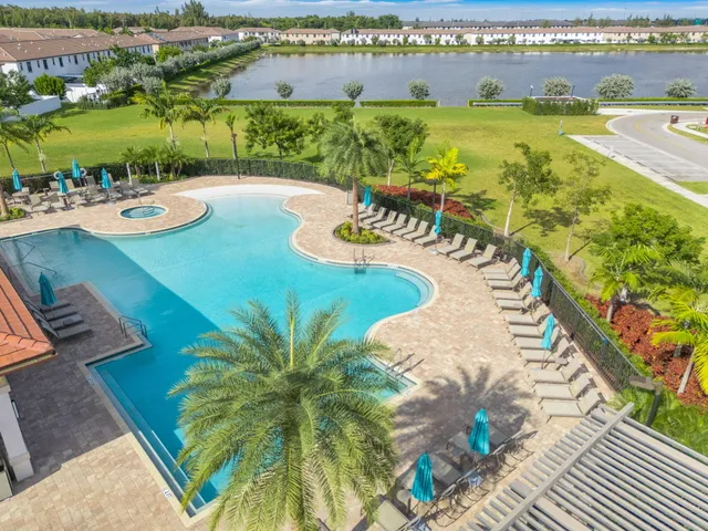 an aerial view of a residential apartment building with outdoor space
