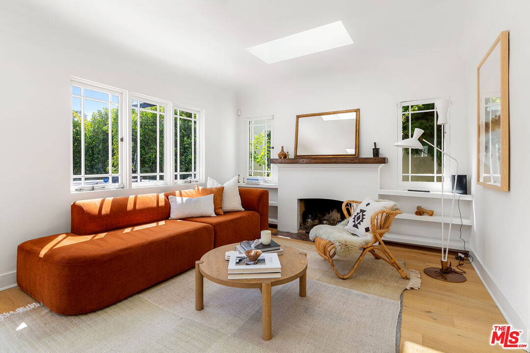 817 Crestmoore Place Venice, CA 90291 - Photo 3 of 22 a living room with furniture a fireplace and a large window