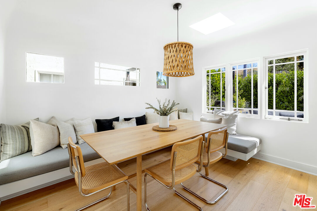817 Crestmoore Place Venice, CA 90291 - Photo 6 of 22 a view of a dining room with furniture wooden floor and a chandelier