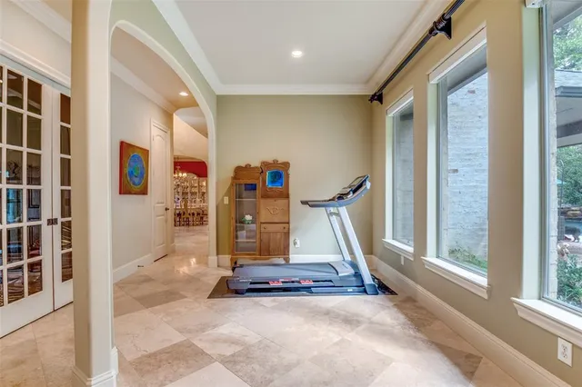 a view of gym equipment with windows