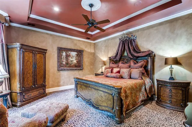 a bedroom with a bed a dresser and potted plants