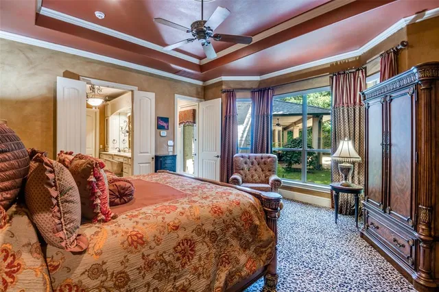 a bed room with a bed and a television