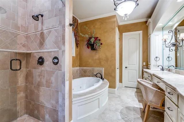 a bathroom with a tub a sink and a shower
