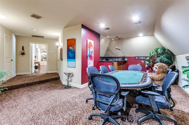 a dining room with furniture and wooden floor