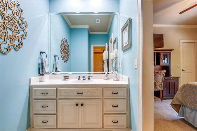 a bathroom with a sink vanity and mirror
