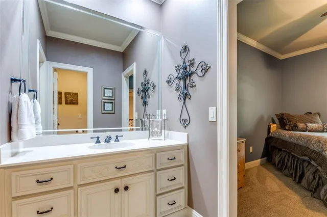 a bathroom with a double vanity sink a mirror and a shower