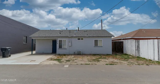 a front view of a house with a garage