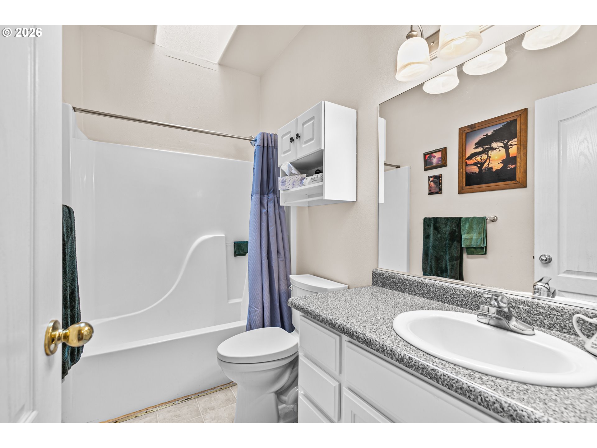 419 Idlewild Drive Cave Junction, OR 97523 - Photo 11 of 47 a bathroom with a granite countertop sink mirror vanity and toilet
