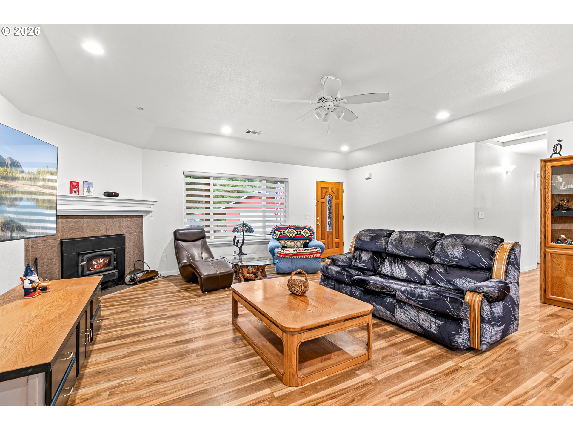 419 Idlewild Drive Cave Junction, OR 97523 - Photo 25 of 47 a living room with furniture and a fireplace