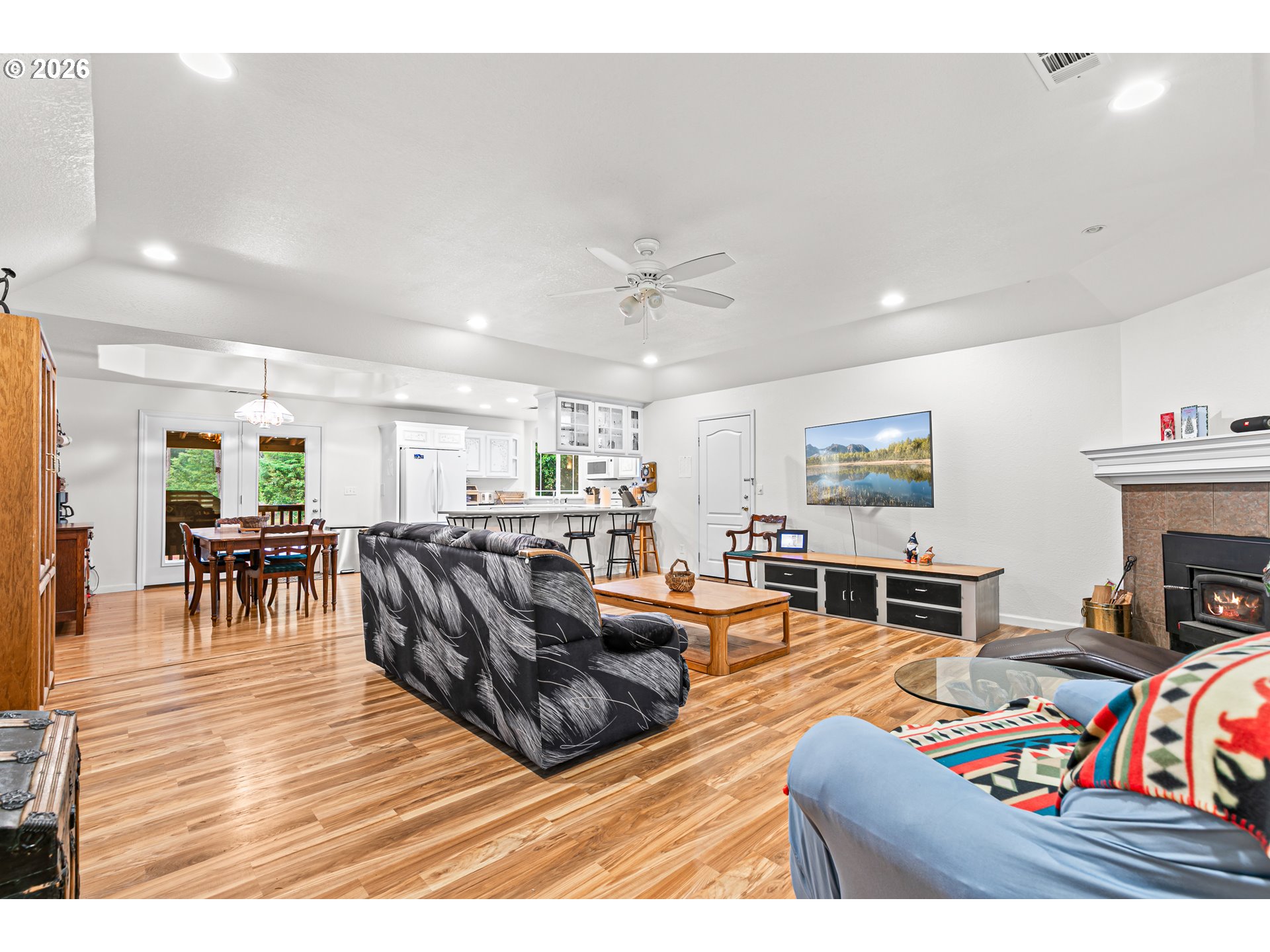 419 Idlewild Drive Cave Junction, OR 97523 - Photo 26 of 47 a living room with furniture and a fireplace