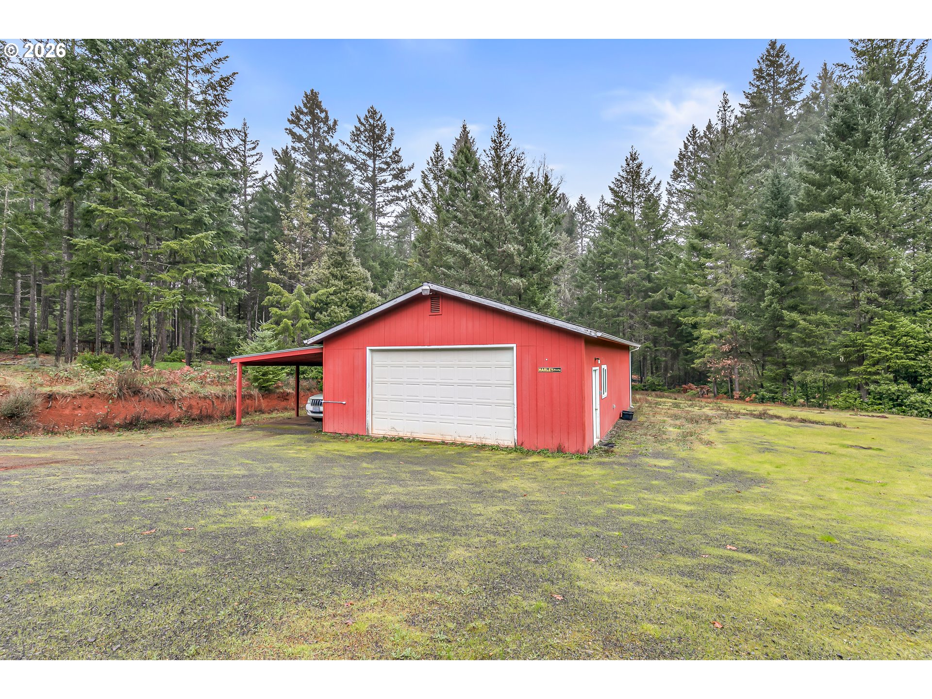 419 Idlewild Drive Cave Junction, OR 97523 - Photo 31 of 47 a big yard with lots of green space in the back