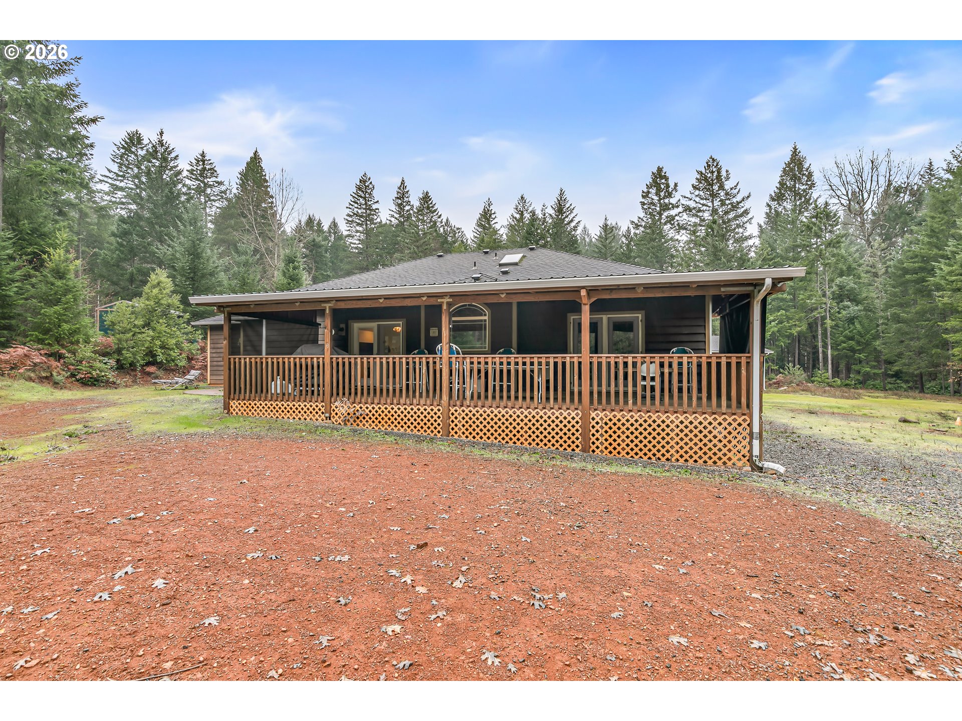 419 Idlewild Drive Cave Junction, OR 97523 - Photo 36 of 47 a house view with a garden space