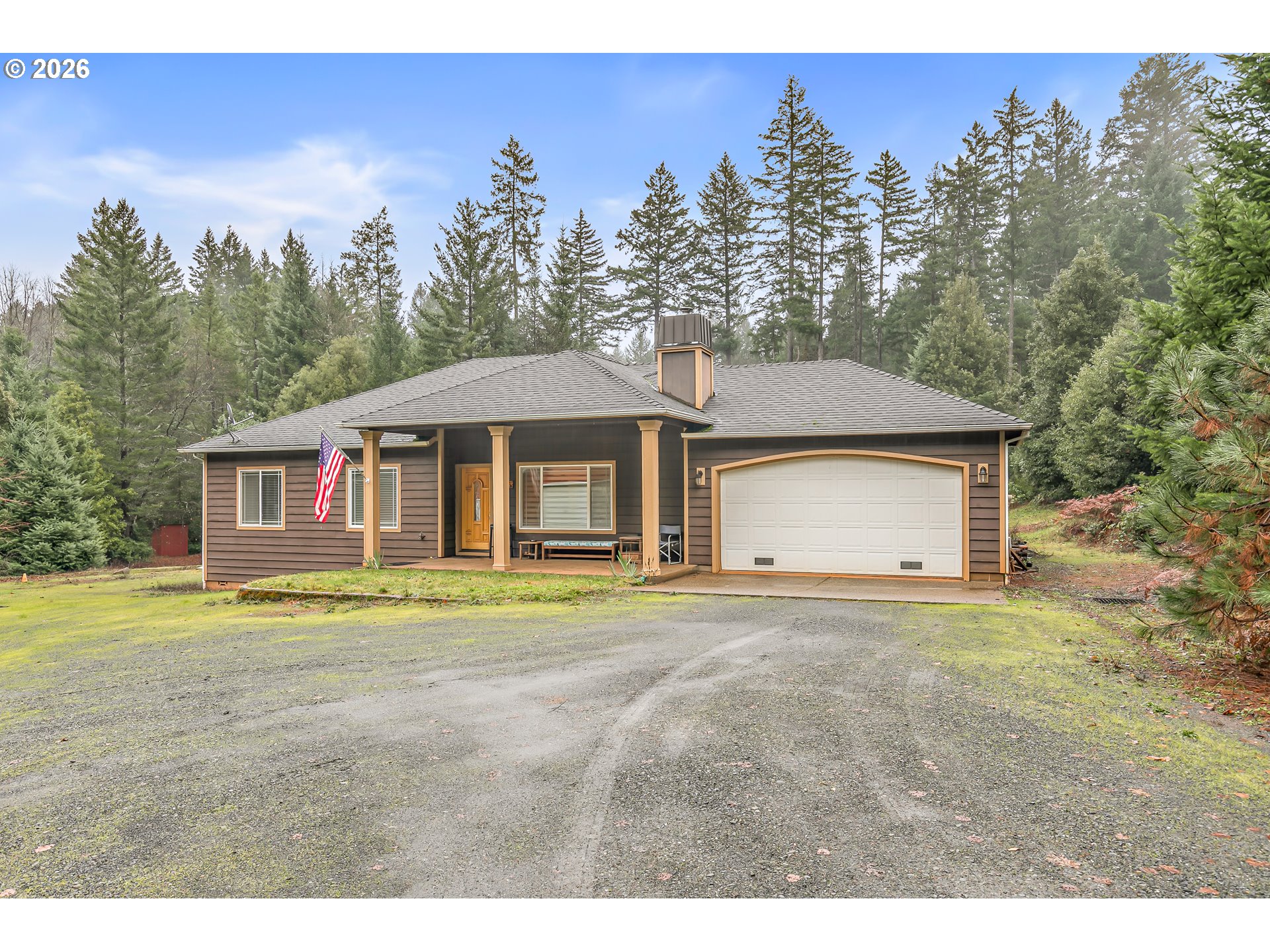 419 Idlewild Drive Cave Junction, OR 97523 - Photo 40 of 47 a front view of a house with a yard