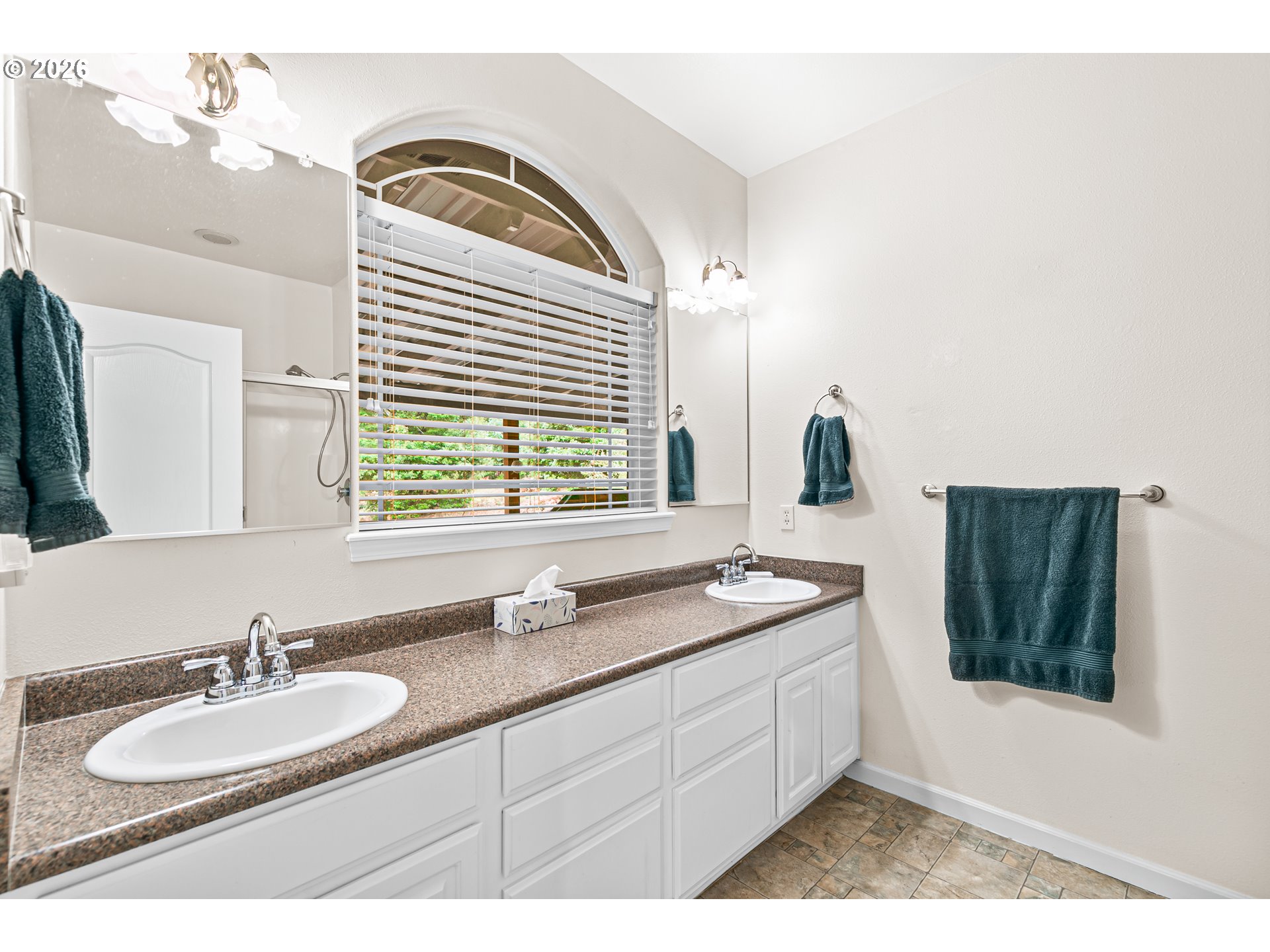 419 Idlewild Drive Cave Junction, OR 97523 - Photo 6 of 47 a bathroom with a granite countertop double vanity sink and mirror