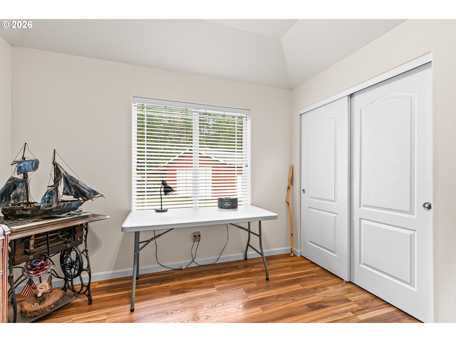 419 Idlewild Drive Cave Junction, OR 97523 - Photo 10 of 47 a view of a room with a window and wooden floor